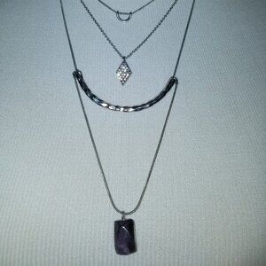 Free with $20 purchase Silver necklace with 4 different charms 20"